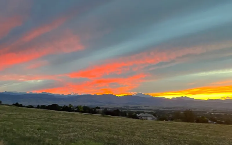 The trail at the edge of the grassland east of Niwot, looking west toward the foothills at sunset