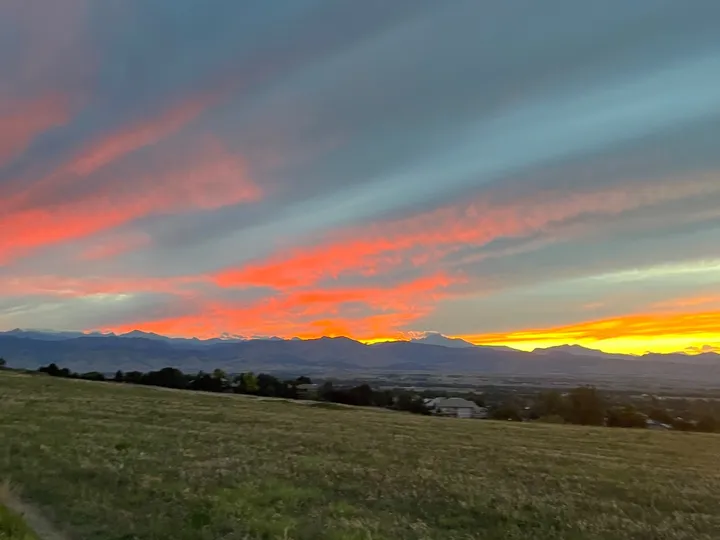 A gravel trail at the edge of the grassland east of Niwot, looking west toward the foothills at sunset
