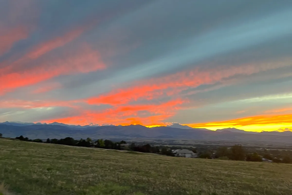 A gravel trail at the edge of the grassland east of Niwot, looking west toward the foothills at sunset